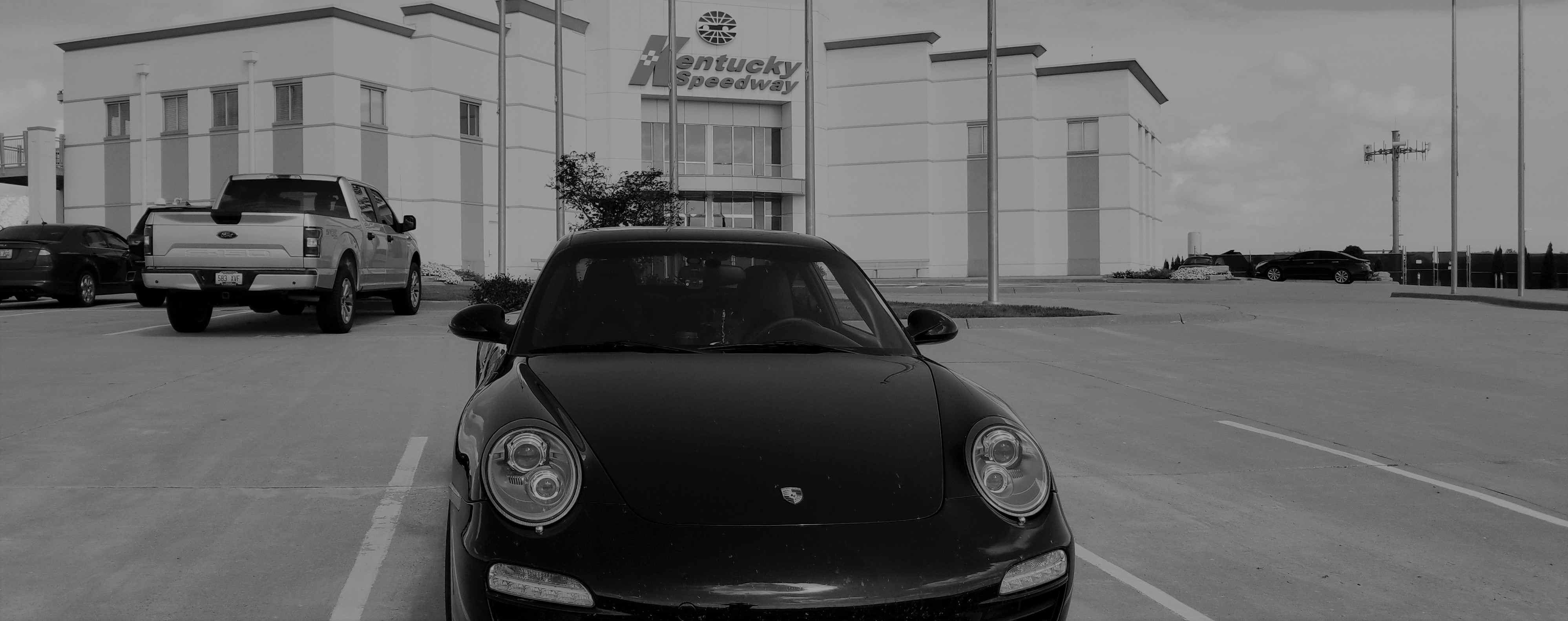 2012 Porsche 911 Carrera 4GTS in front of Kentucky Speedway offices